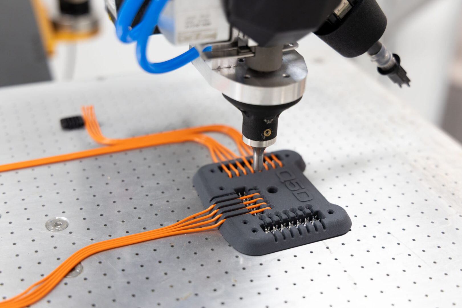 Q5D automated wiring assembly. Wire onto PSA film with IDC