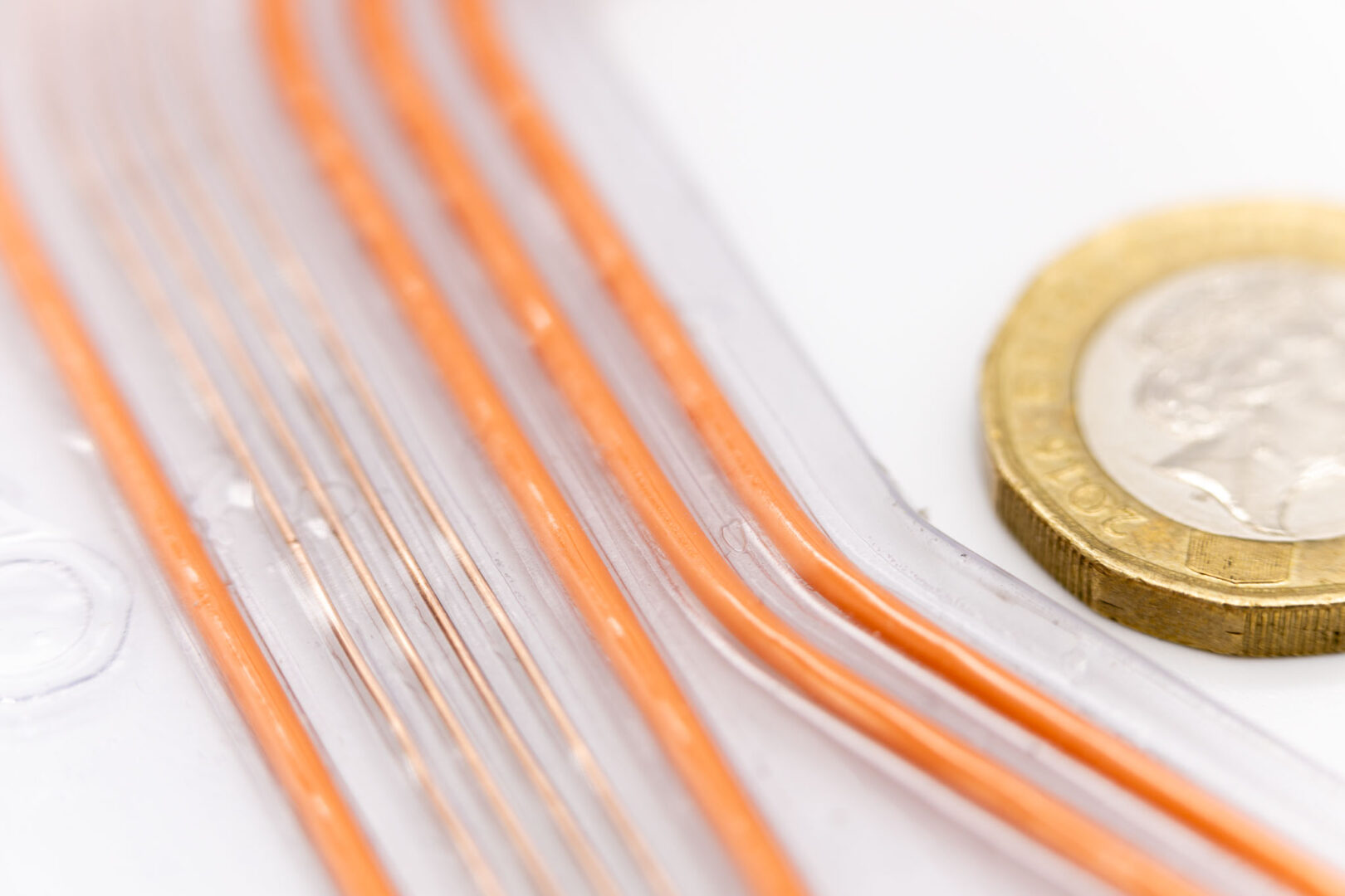 closeup of flat wiring harness with coin